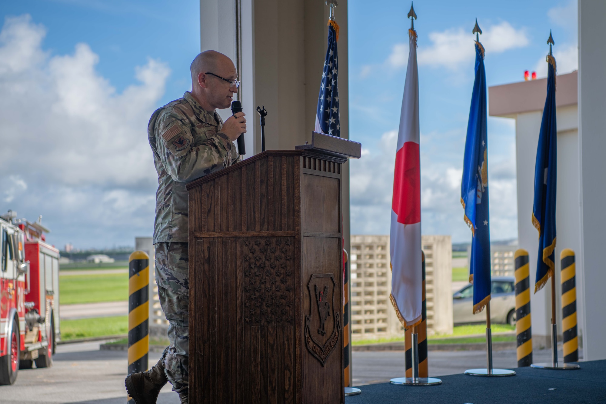 military member speaks at a podium giving a speech
