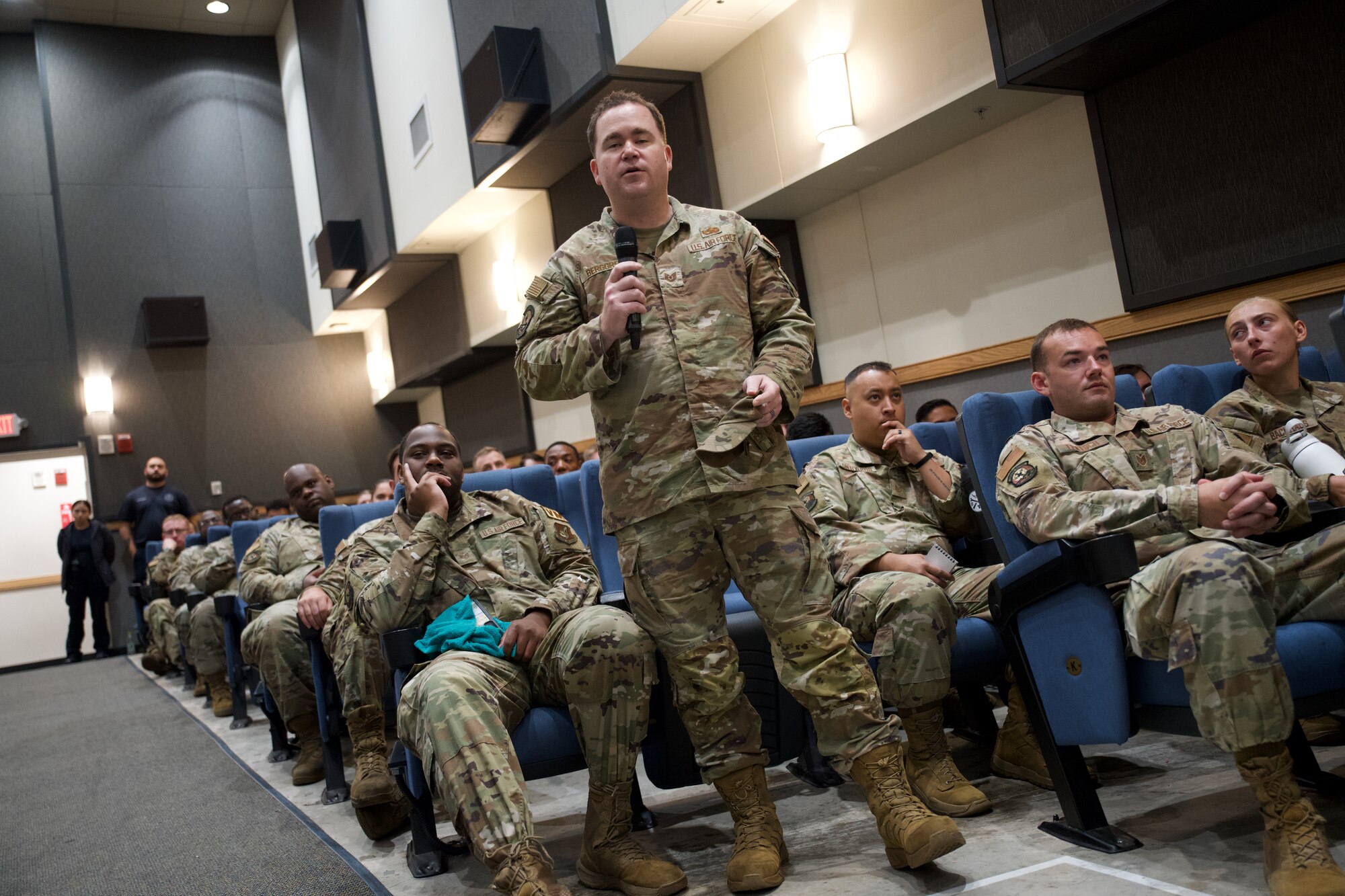 U.S. Air Force Tech. Sgt. Joseph Berggren, 8th Logistics Readiness Squadron vehicle maintenance specialist, asks Chief Master Sgt. Jeremiah Ross, 7th Air Force command chief, a question while attending a noncommissioned officer all-call at.