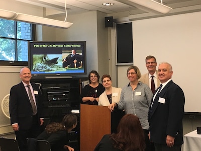 The USCG Historian's Office Team at the 2023 McMullen Naval History Symposium held at U.S. Naval Academy in September, 2017.  Left to right: Scott Price (Chief Historian); Nora Chidlow (Archive Technician); Beth Crumley (Assistant Historian); Arlyn Danielson (Curator); Dr. Bill Thiesen (LANTAREA Historian) & Chris Havern (NHHC Historian & former Assistant CG Historian).