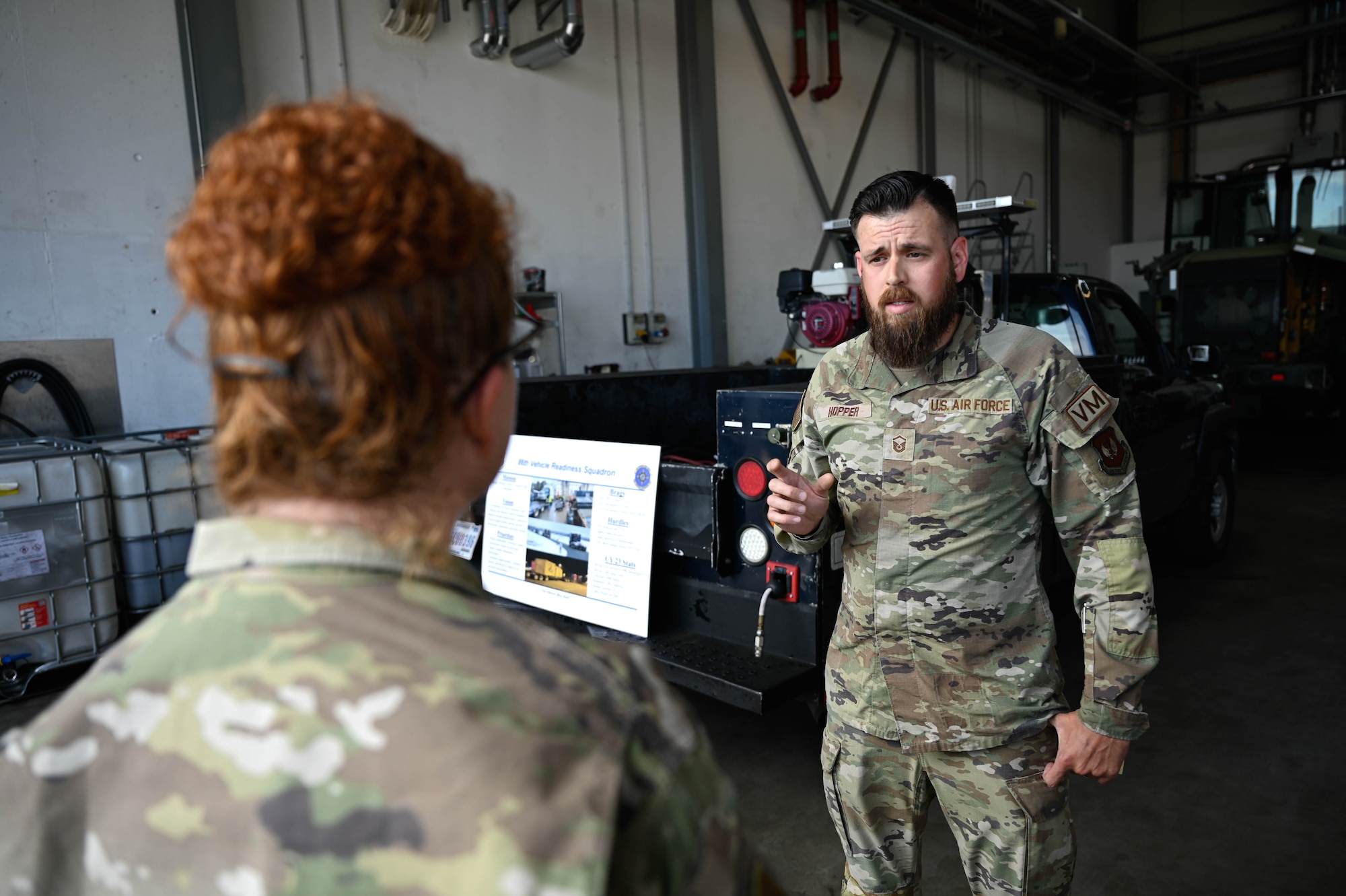 U.S. Air Force General Williams speaks with U.S. Air Force Master Sergeant Jared Hopper