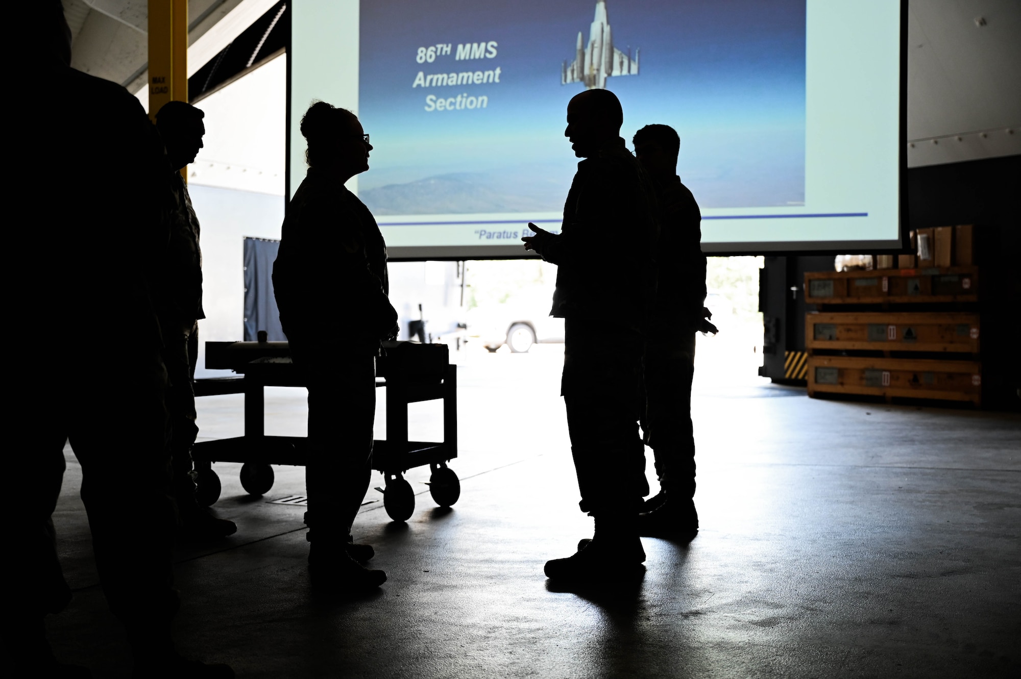 U.S. Air Force Brigadier General receives briefing from Technical Sergeant Francisco Natali