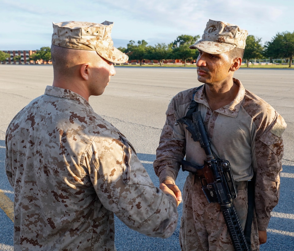 U.S. Marine Corps Pvt. Ali Abbas, a Marine with Echo Company, 2nd Recruit Training Battalion, completes the transformation from civilian to Marine on Marine Corps Recruit Depot Parris Island, S.C., July 12, 2024. To complete recruit training Abbas had to complete numerous events such as physical fitness tests, rifle qualification, obstacle courses, CBRN and rappel training, all culminating with the Crucible. (U.S. Marine Corps photo by Lance Cpl. William Horsley)