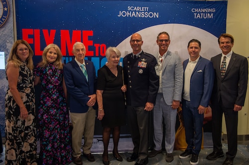 Chief Master Sgt. of the Space Force John Bentivegna takes a photo with the director and producers of "Fly Me to the Moon" during a film premiere in Washington, D.C., July 10, 2024. Bentivegna spoke about the Space Force's role in the making of the film and how films about space exploration can inspire people to pursue careers in the space domain. (U.S. Air Force photo by Staff Sgt. Adam R. Shanks)