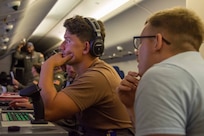 ROMANIA (July 9, 2024) Aircrewman (Operator) 3rd Class Travis Boles, assigned to Patrol Squadron (VP) 45, left, works with Aircrewman (Operator) 2nd Class Charles Cooke, right, to conduct flight operations aboard a P-8A Poseidon Aircraft as part of the 28th iteration of the annual exercise Breeze 2024, July 9, 2024. Led by the Bulgarian Navy and scheduled in the Black Sea, Breeze 2024 is focused on anti-submarine warfare, search and rescue, force protection/anti-terrorism operations, maritime interdiction operations and anti-piracy mission areas. (U.S. Navy photo by Mass Communication Specialist 2nd Class Jonathan D. Berlier)
