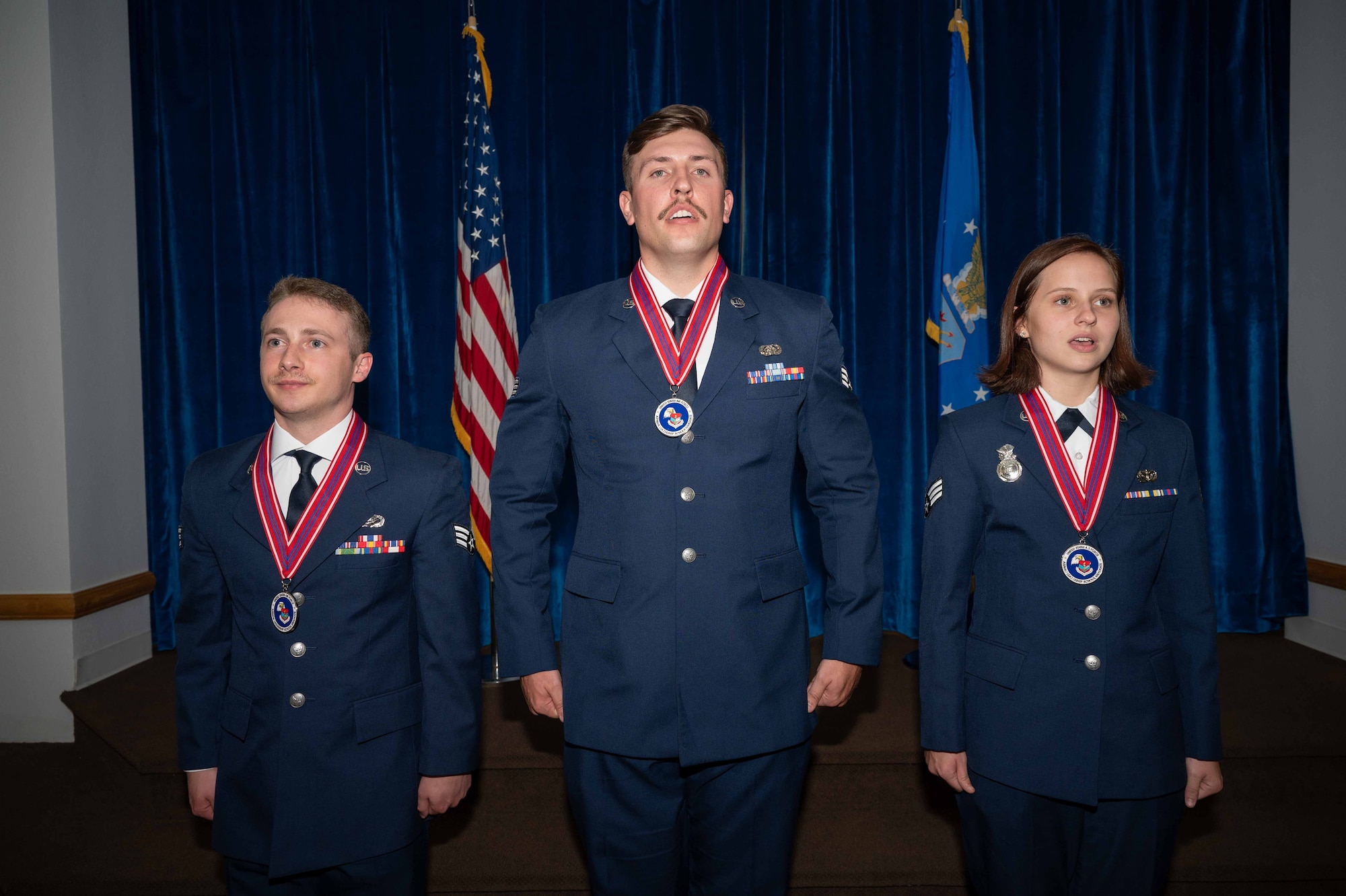 ALS graduate award winners sing the Air Force Song.