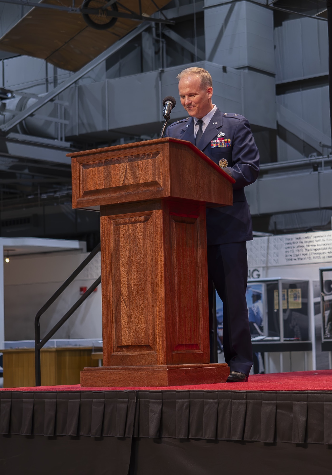 Air Force Research Laboratory, or AFRL, Commander Brig. Gen. Jason E. Bartolomei addresses a crowd of family, friends and colleagues at a change of command ceremony at the National Museum of the United States Air Force in Dayton, Ohio, July 10, 2024, immediately following his assumption of duties. “I believe the mission of AFRL has never been more critical,” Bartolomei said. “The future of the fight depends on our innovations, technical wizardry, and our role to support and integrate within the air and space domains. Like the past, our success depends on the brilliant, patriotic, hardworking, faithful men and women from all ranks and all walks of life banding together to deliver game-changing technology.” (U.S. Air Force photo / Keith Lewis)