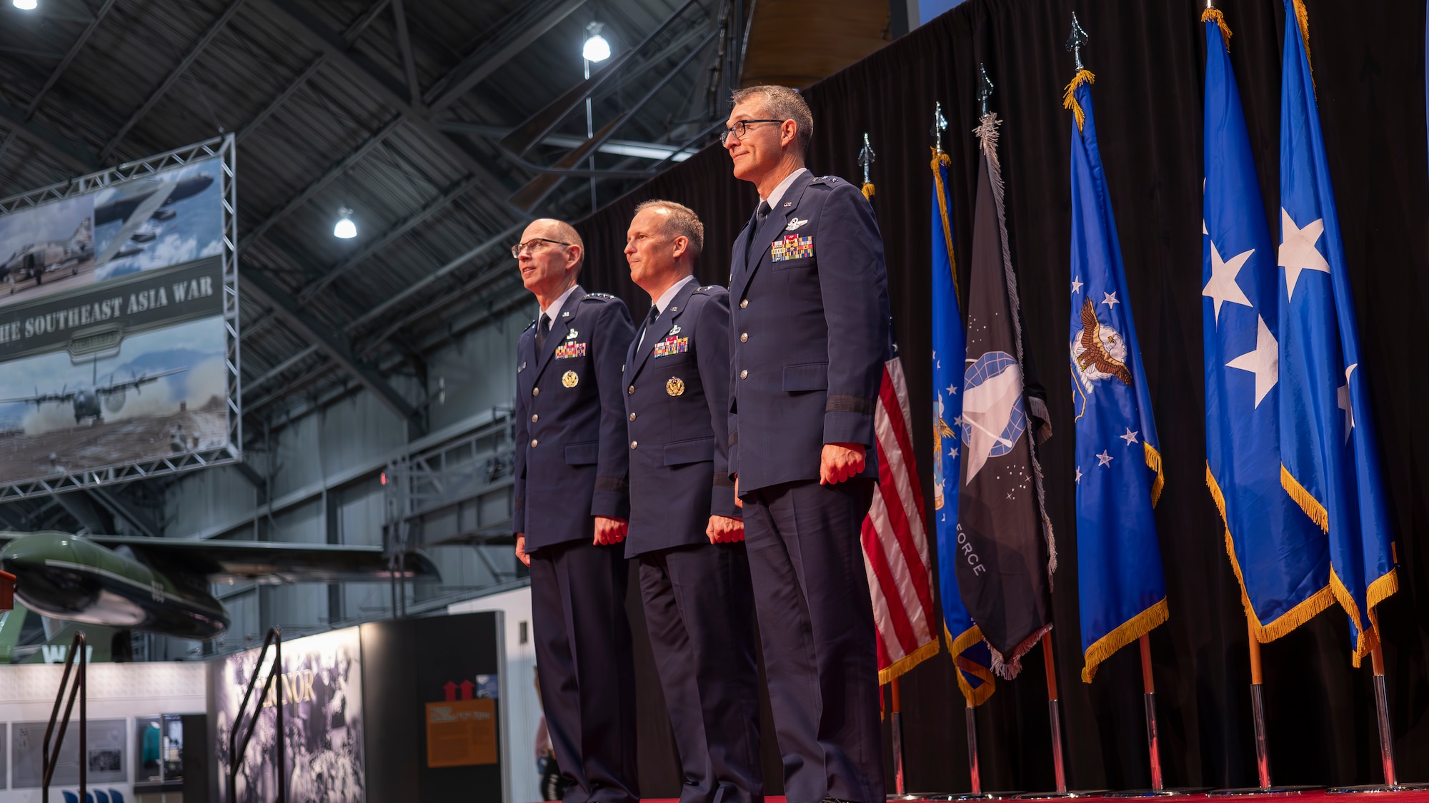 Gen. Duke Z. Richardson, commander, Air Force Materiel Command, left, stands beside new Air Force Research Laboratory, or AFRL, commander Brig. Gen. Jason E. Bartolomei, middle, and outgoing AFRL commander Maj. Gen. Scott A. Cain, right, at an AFRL change of command ceremony at the National Museum of the United States Air Force in Dayton, Ohio, July 10, 2024. As AFRL’s newest commander, Bartolomei now oversees more than 12,500 Airmen, Space Force Guardians, Pentagon civilians and contractors. (U.S. Air Force photo / Keith Lewis)