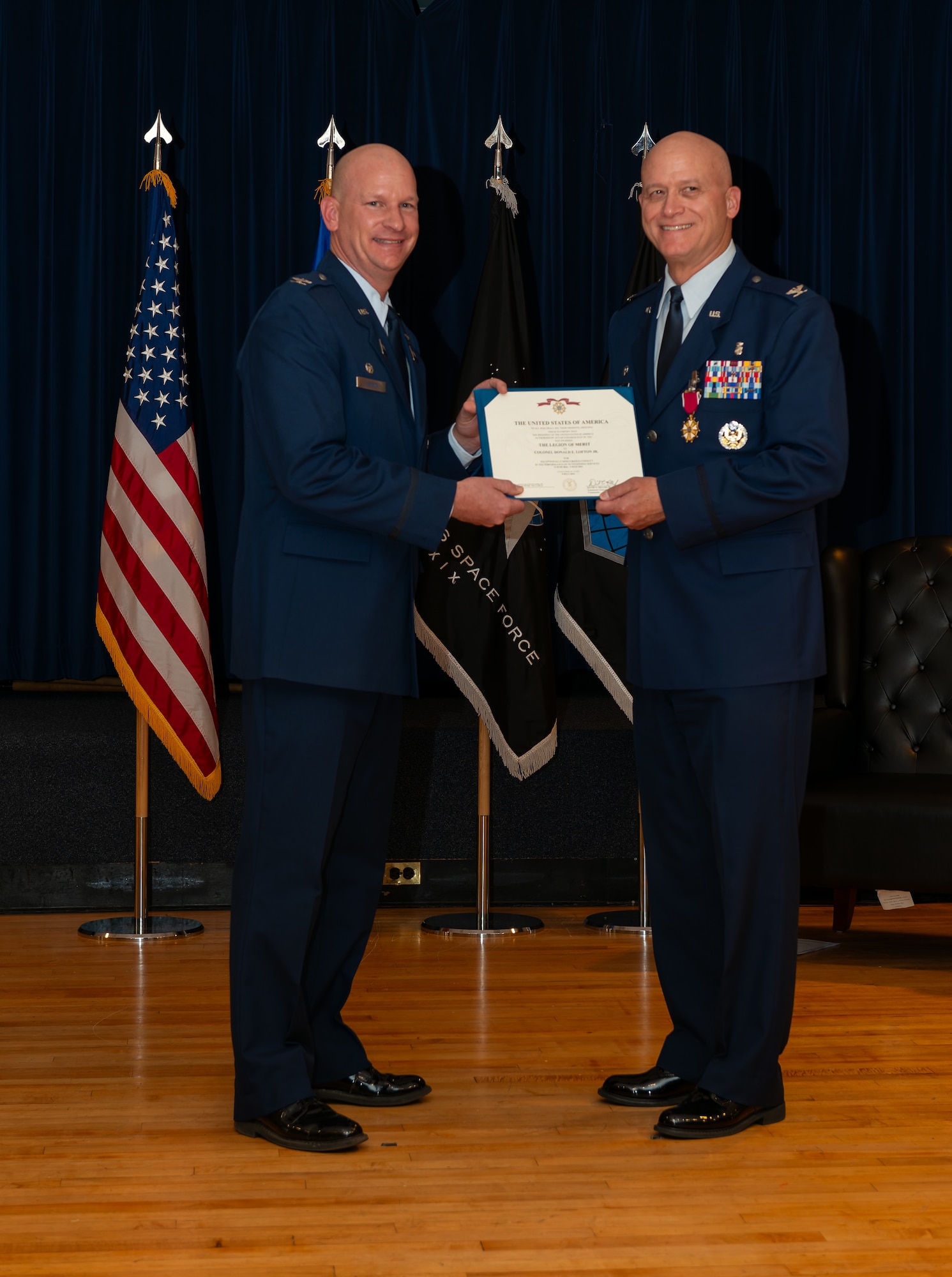 The Legion of Merit is presented to the former MDG commander