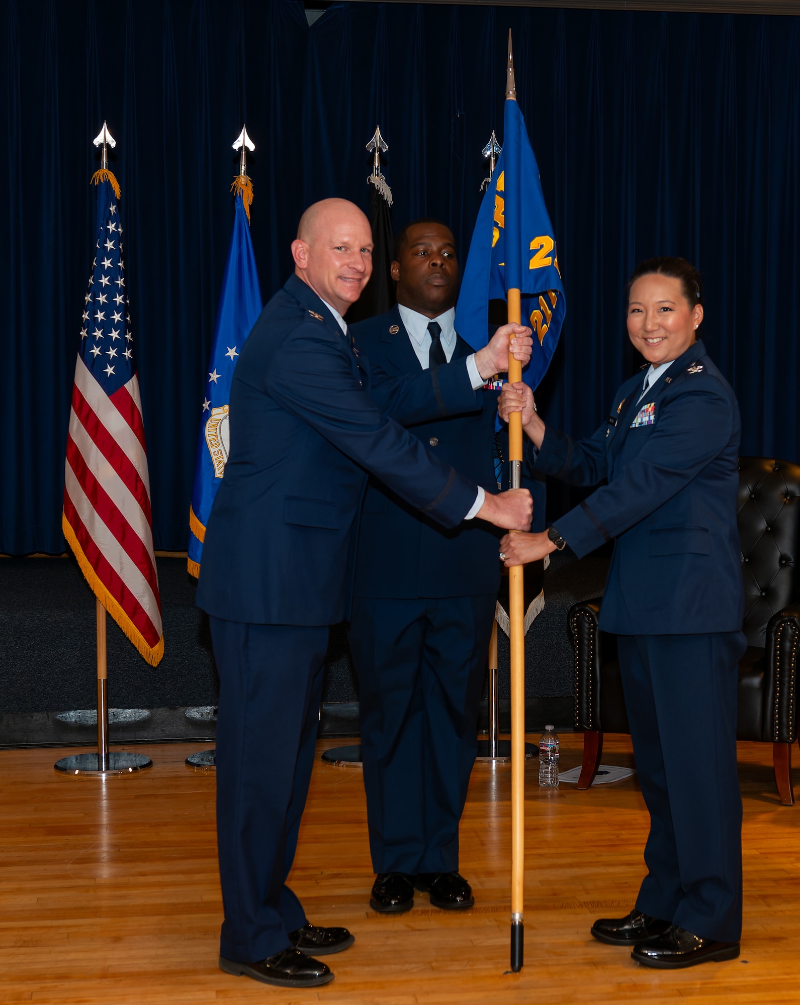 guidon is being handed to new commander from SBD 1 commander