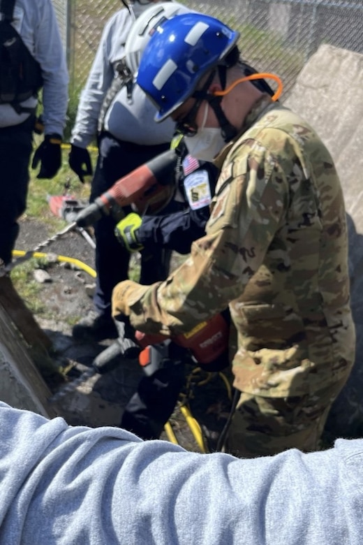 Pennsylvania Air National Guardsman Staff Sgt. Robert Gregor with the 171st Air Refueling Wing Fire and Emergency Services Flight performs stitch cut drilling while receiving training from members of Pennsylvania Strike Team 1, at the Allegheny County Fire Academy, May 8, 2024. The partnership between the 171st and PA ST1 allows for shared resources and expertise, and provides a comprehensive training environment that benefits participants and the communities they serve. (courtesy photo)