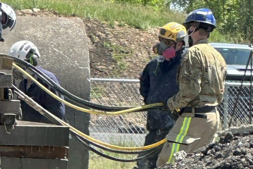 Pennsylvania Air National Guardsman Master Sgt. John Kovacic with the 171st Air Refueling Wing Fire and Emergency Services Flight assists with line management on the DS11 skill station with a member of Pennsylvania Strike Team 1, at the Allegheny County Fire Academy, May 8, 2024. The partnership between the 171st and PA ST1 allows for shared resources and expertise, and provides a comprehensive training environment that benefits participants and the communities they serve. (courtesy photo)