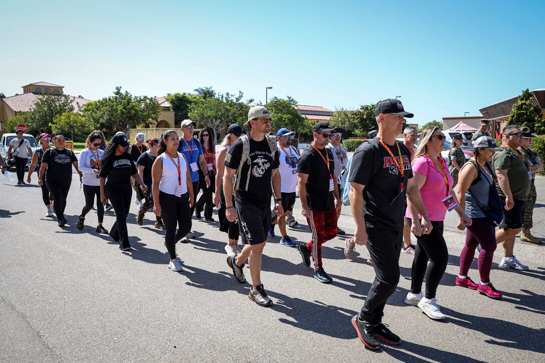 Educators and influencers participating in Marine Corps Recruit Depot San Diego's Educators Workshop prepare to march to their next activity on June 24, 2024. Educators and influencers with Recruiting Station Albuquerque visited MCRD San Diego to observe recruit training and gain a better understanding about the transformation from recruit to United Stated Marine. They also received classes and briefs on the benefits that are provided to service members serving in the U.S. Armed Forces. (U.S. Marine photo by Sgt. Mark A. Morales)