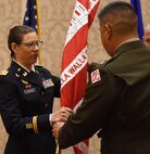 LTC Werback receives the Walla Walla District colors during the District's change of command ceremony at the Marcus Whitman Hotel and Conference Center.