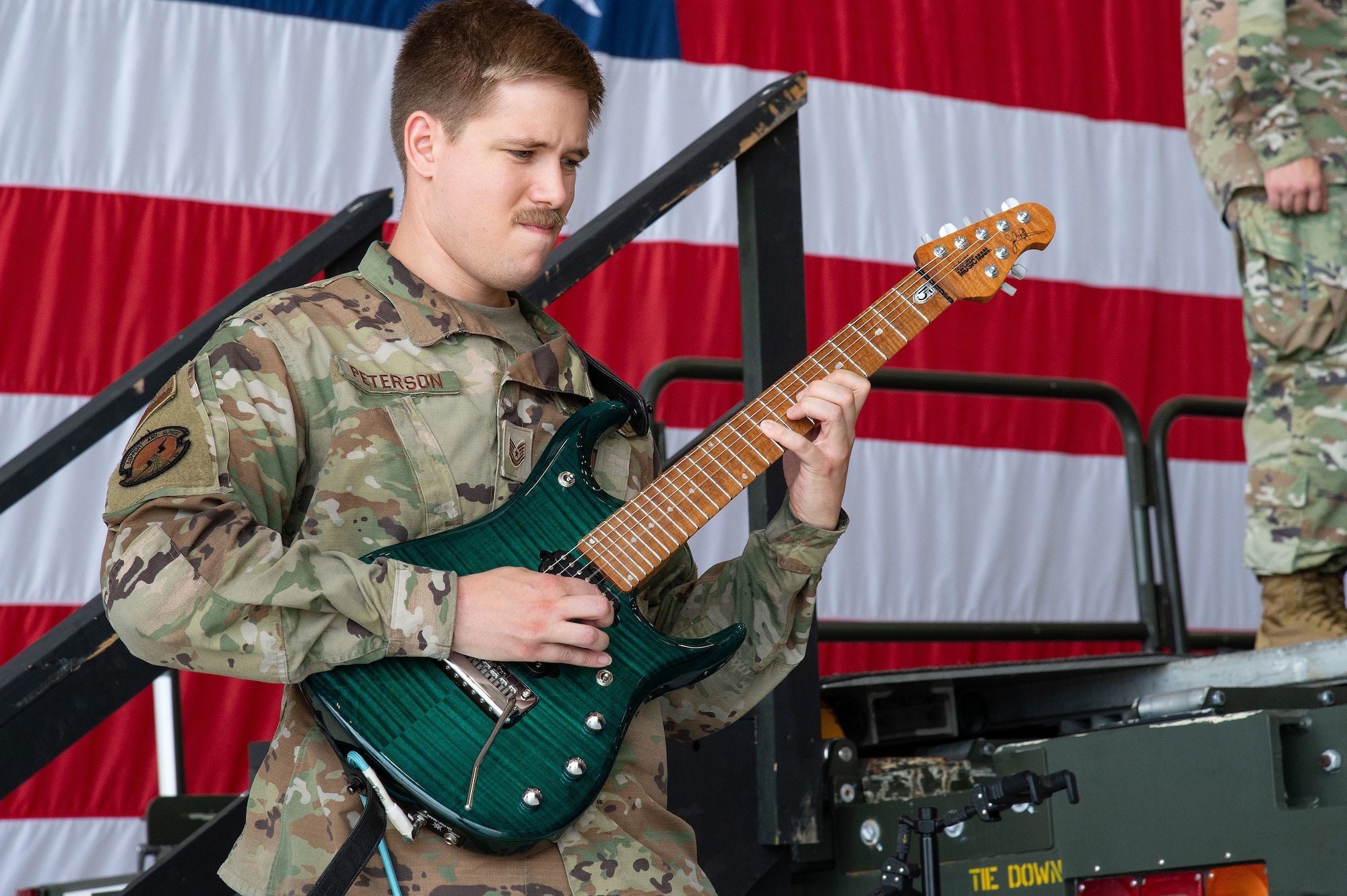 U.S. Air Force Tech. Sgt. Ryan Peterson, 436th Maintenance Squadron isochronal aircraft structural maintenance noncommissioned officer in charge, plays the national anthem during the 436th Mission Generation Group change of command ceremony at Dover Air Force Base, Delaware, July 10, 2024. Col. Bary Flack relinquished command to Col. Ernest Cage in a ceremony officiated by Col. Chris McDonald, 436th Airlift Wing commander. (U.S. Air Force photo by Roland Balik)