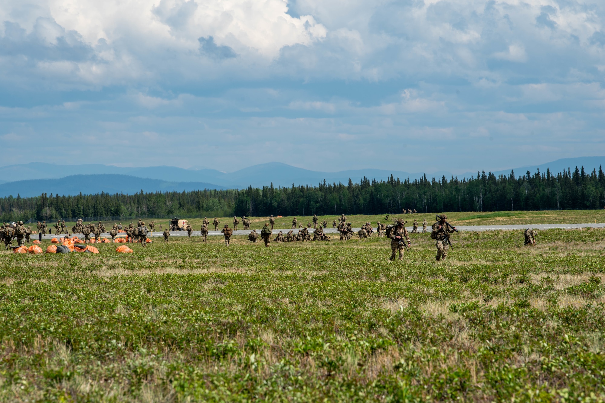 U.S. Army Soldiers from the 11th Airborne Division form up after parachuting at Fort Greely, Alaska.
