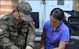 Army CID, FXD Firearm and Toolmark examiner Mary Ulloa discusses ways to restore obliterated serial numbers from firearms with a Tunisian Officer during African Lion 2024.