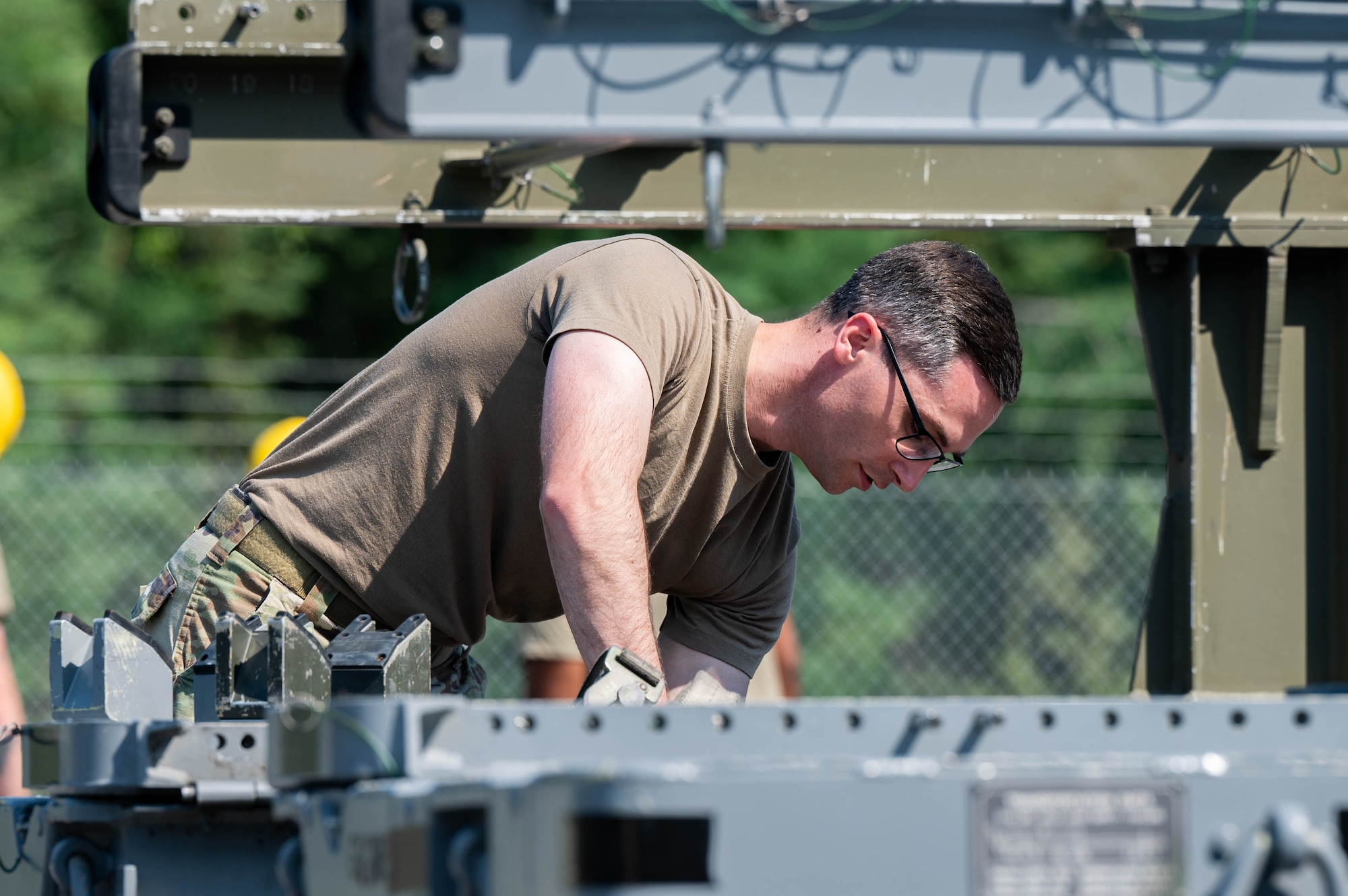 An Airman inspects a trailer.