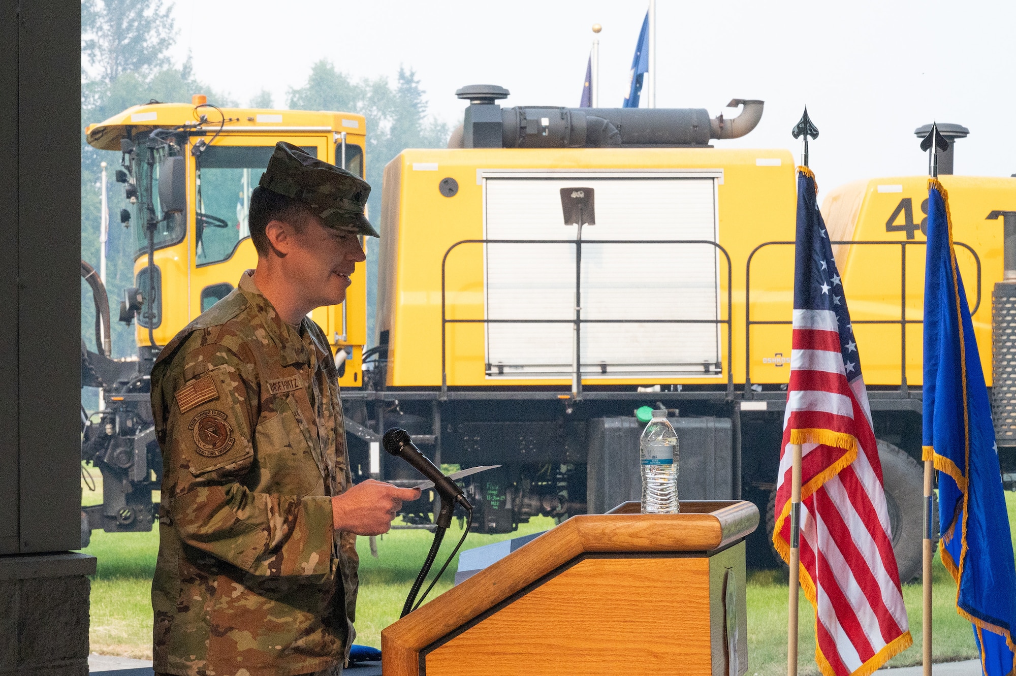 A new squadron commander speaks during a change of command ceremony.