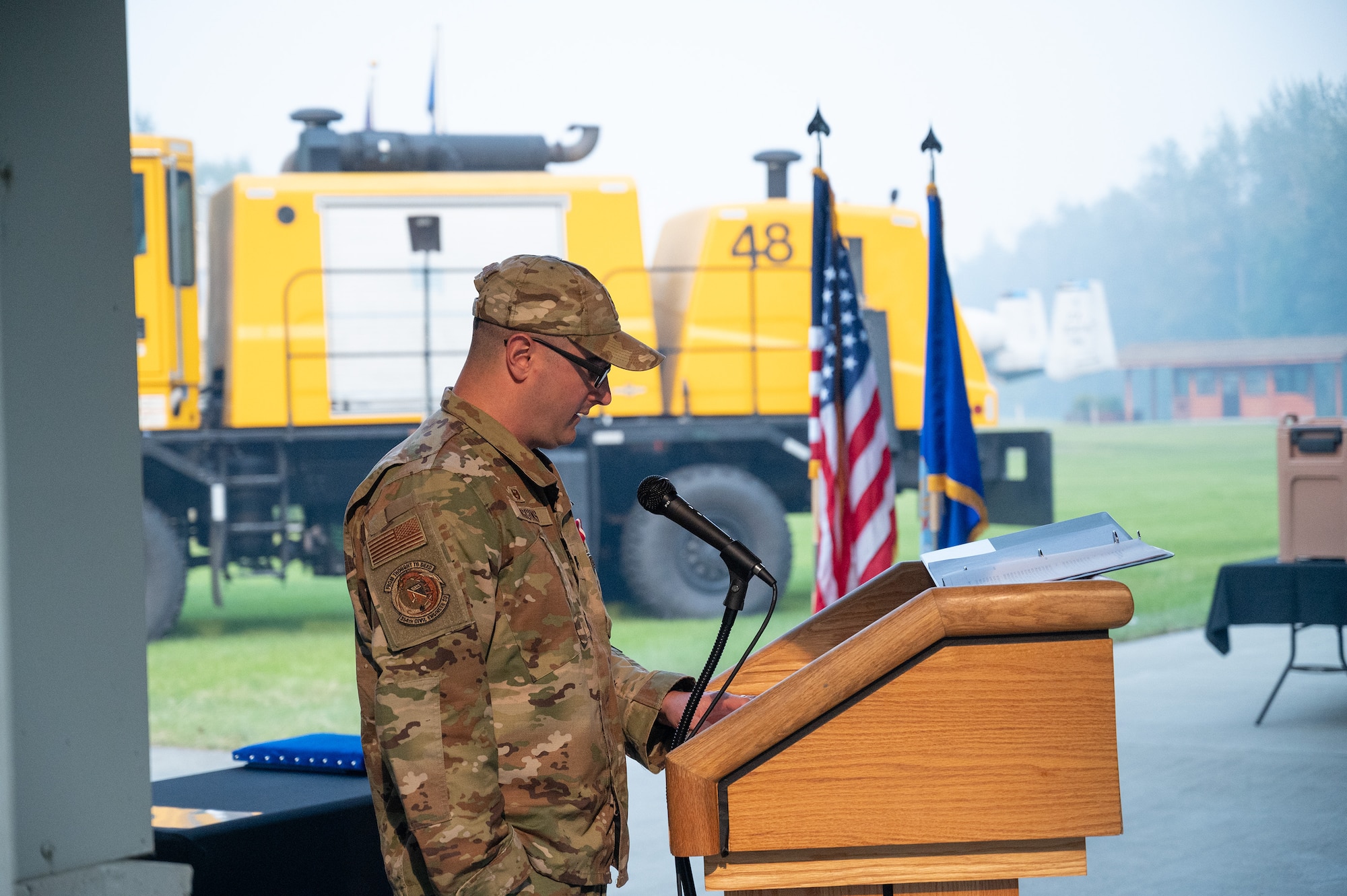 A squadron commander speaks during a ceremony.