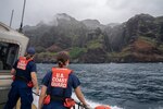 U.S. Coast Guard Petty Officer 1st Class Lindsy Martin (left) and Petty Officer 3rd Class Kai Hall, two U.S. Coast Guard Station Kauai members, stand on the aft deck of a 45-foot response boat while conducting a patrol around the island of Kauai, Hawaii, May 23, 2024. U.S. Coast Guard Station Kauai conducts an area of responsibility familiarization patrol around the island of Kauai, Hawaii. (U.S. Coast Guard photo by Petty Officer 2nd Class Tyler Robertson)