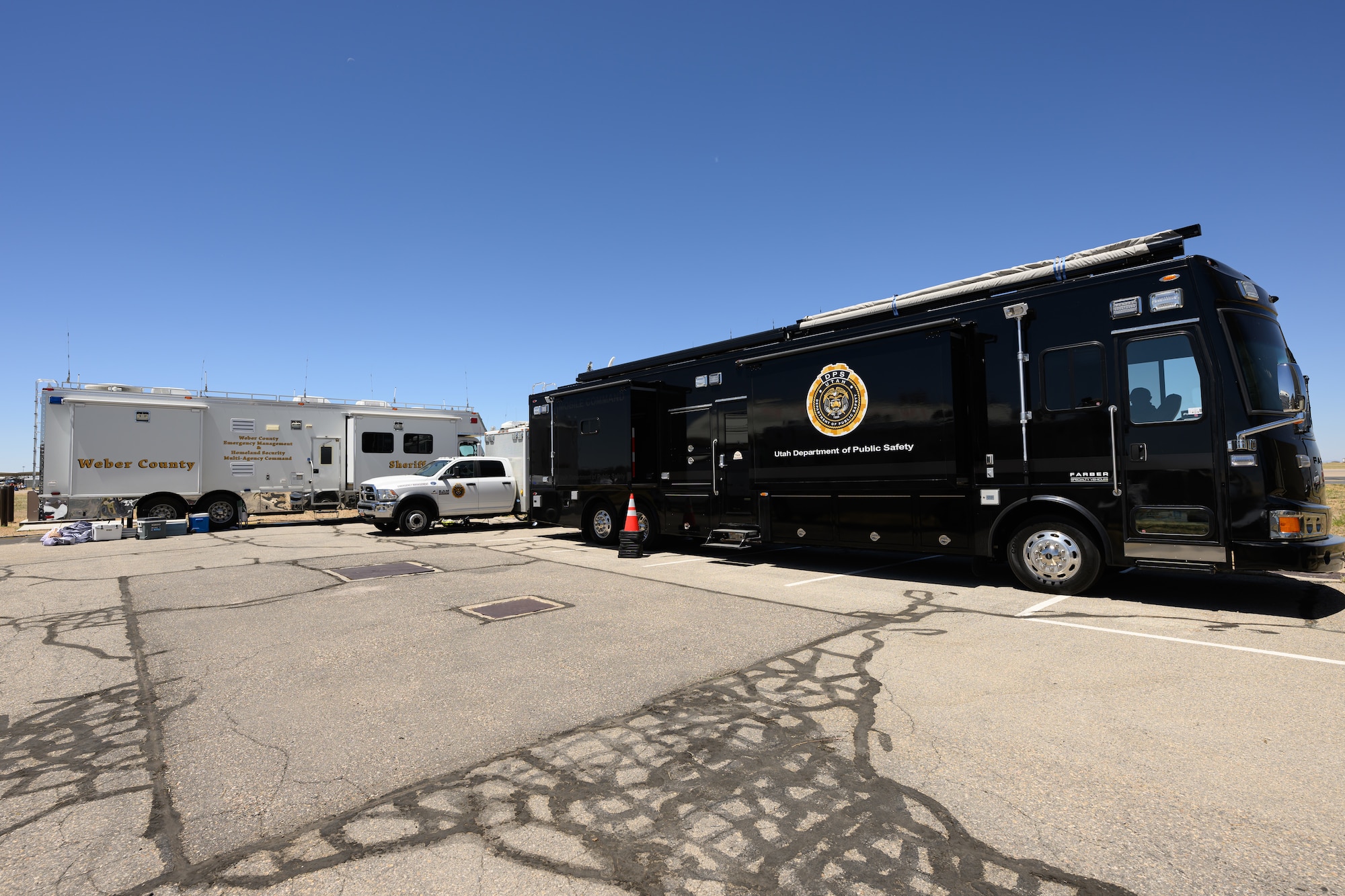 Weber County Emergency Management and Utah Department of Public Safety RVs sit airfield.