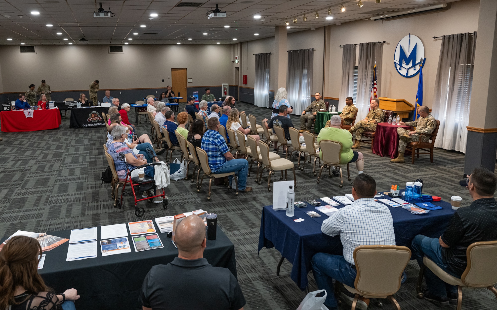 Military retirees participate in a Q&A event with Team Minot senior leaders during Retiree Appreciation Day at Minot Air Force Base, North Dakota, July 12, 2024. The event provided an opportunity for military retirees to learn more about how Minot AFB and the Air Force has evolved over the years. (U.S. Air Force photo by Senior Airman Kyle Wilson)