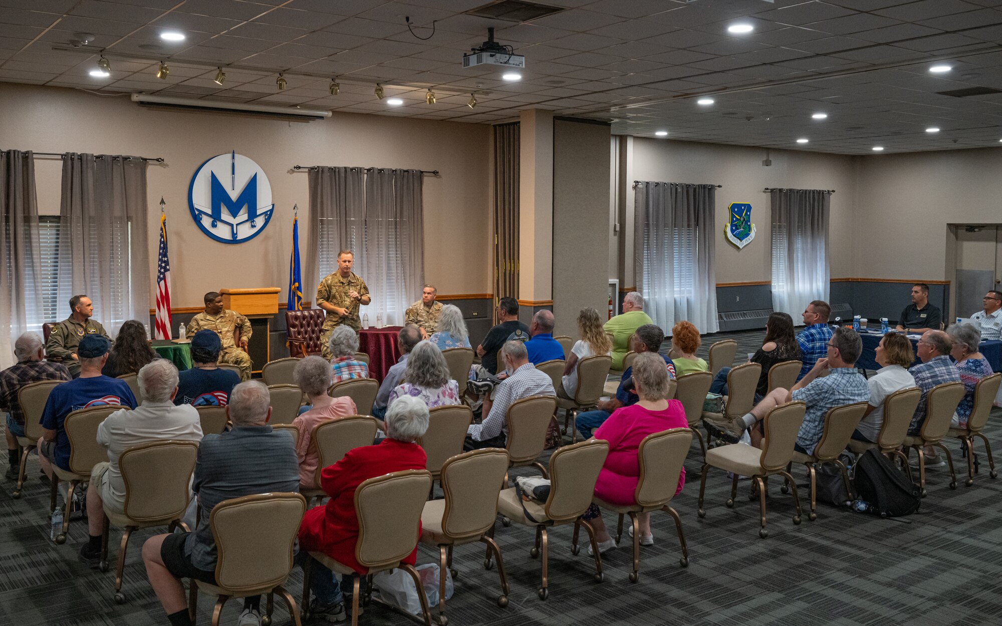 U.S. Air Force Col. James Schlabach, 91st Missile Wing commander, speaks to military retirees during Retiree Appreciation Day at Minot Air Force Base, North Dakota, July 12, 2024. Schlabach expressed gratitude to the retirees for their service and thanked them for attending the event. (U.S. Air Force photo by Senior Airman Kyle Wilson)