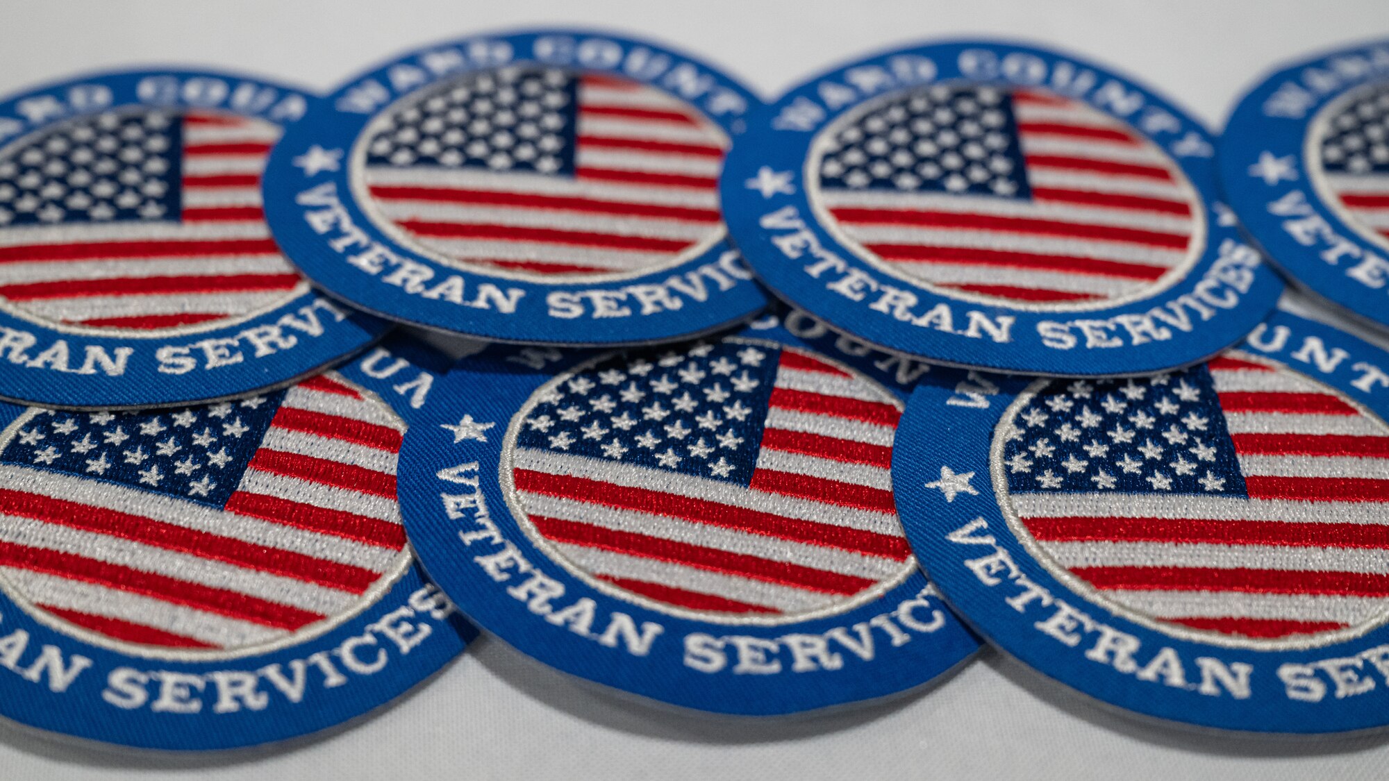 Patches are displayed by Ward County Veteran Services Organization during Retiree Appreciation Day at Minot Air Force Base, North Dakota, July 12, 2024. A number of agencies attended Retiree Appreciation Day to provide support to military retirees. (U.S. Air Force photo by Senior Airman Kyle Wilson)
