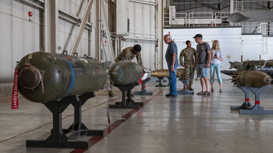 Airmen assigned to the 5th Maintenance Group display a variety of inert munitions to military retirees inside a B-52H Stratofortress hangar during Retiree Appreciation Day at Minot Air Force Base, North Dakota, July 12, 2024. The B-52 is capable of launching the widest array of weapons in the U.S. inventory. (U.S. Air Force photo by Senior Airman Kyle Wilson)