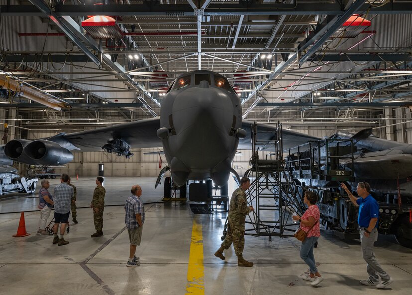 Airmen assigned to the 5th Maintenance Group provide a tour of a B-52H Stratofortress hangar to military retirees during Retiree Appreciation Day at Minot Air Force Base, North Dakota, July 12, 2024. B-52 Stratofortresses have been in service at Minot AFB since 1961. (U.S. Air Force photo by Senior Airman Kyle Wilson)