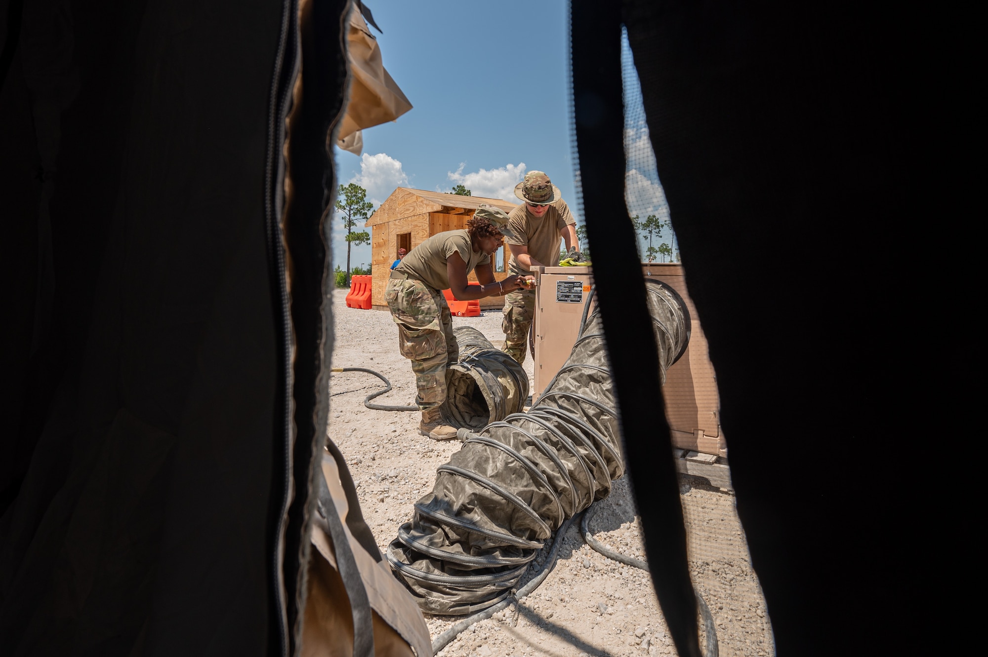 Airmen take AC unit apart