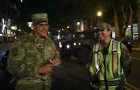 U.S. Army Brig. Gen Craig M. Maceri, Land Component Commander for the District of Columbia National Guard, left, speaks with U.S. Air Force Senior Airman Catherine Sarmiento, materiel management specialist with the 113th Logistics Readiness Squadron, right, in Washington D.C. on July 9, 2024. Members of the District of Columbia and Maryland National Guard supported Metropolitan police during the 75th anniversary of the NATO alliance.