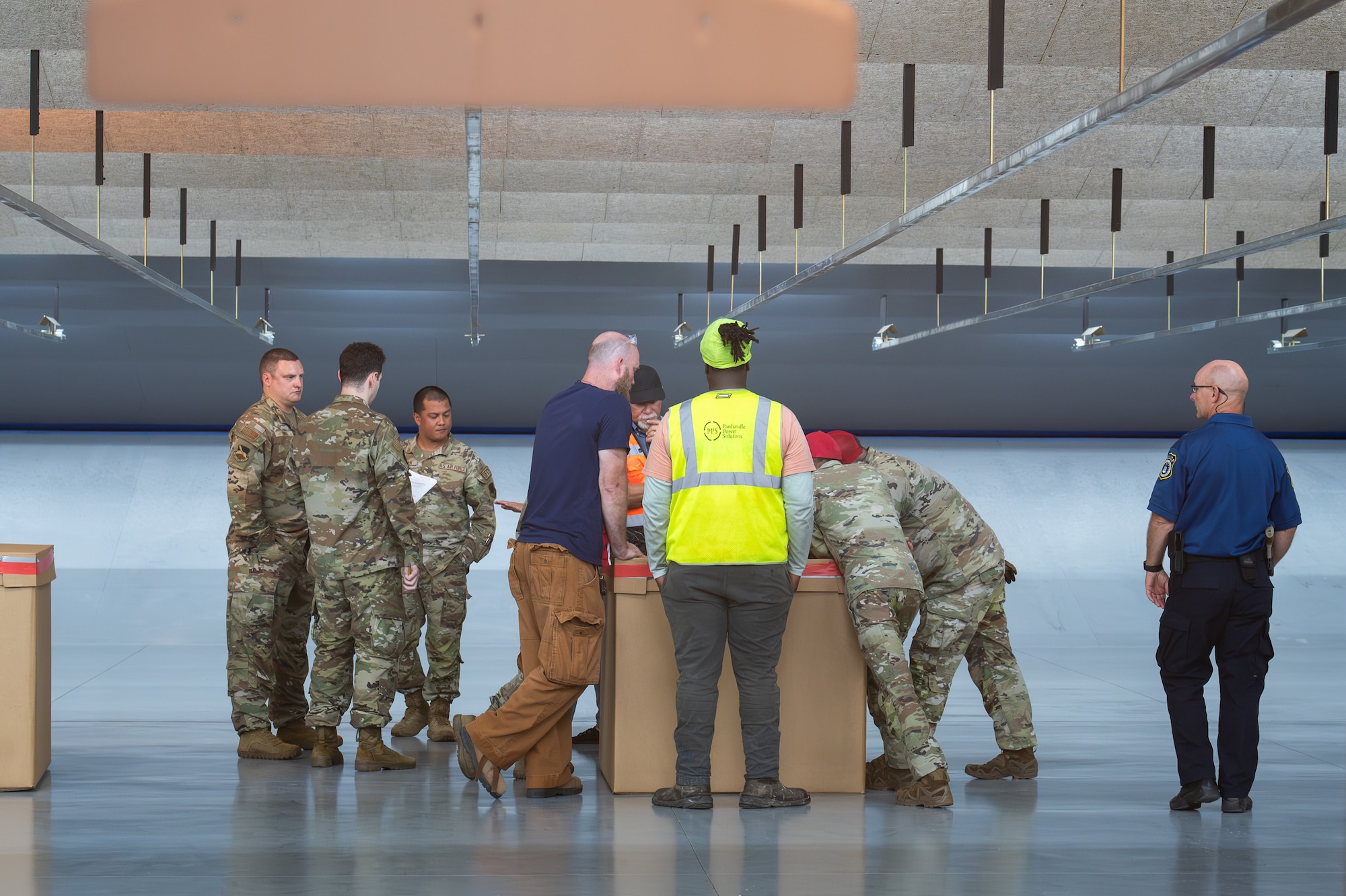 Airmen and contractors discuss reports from range