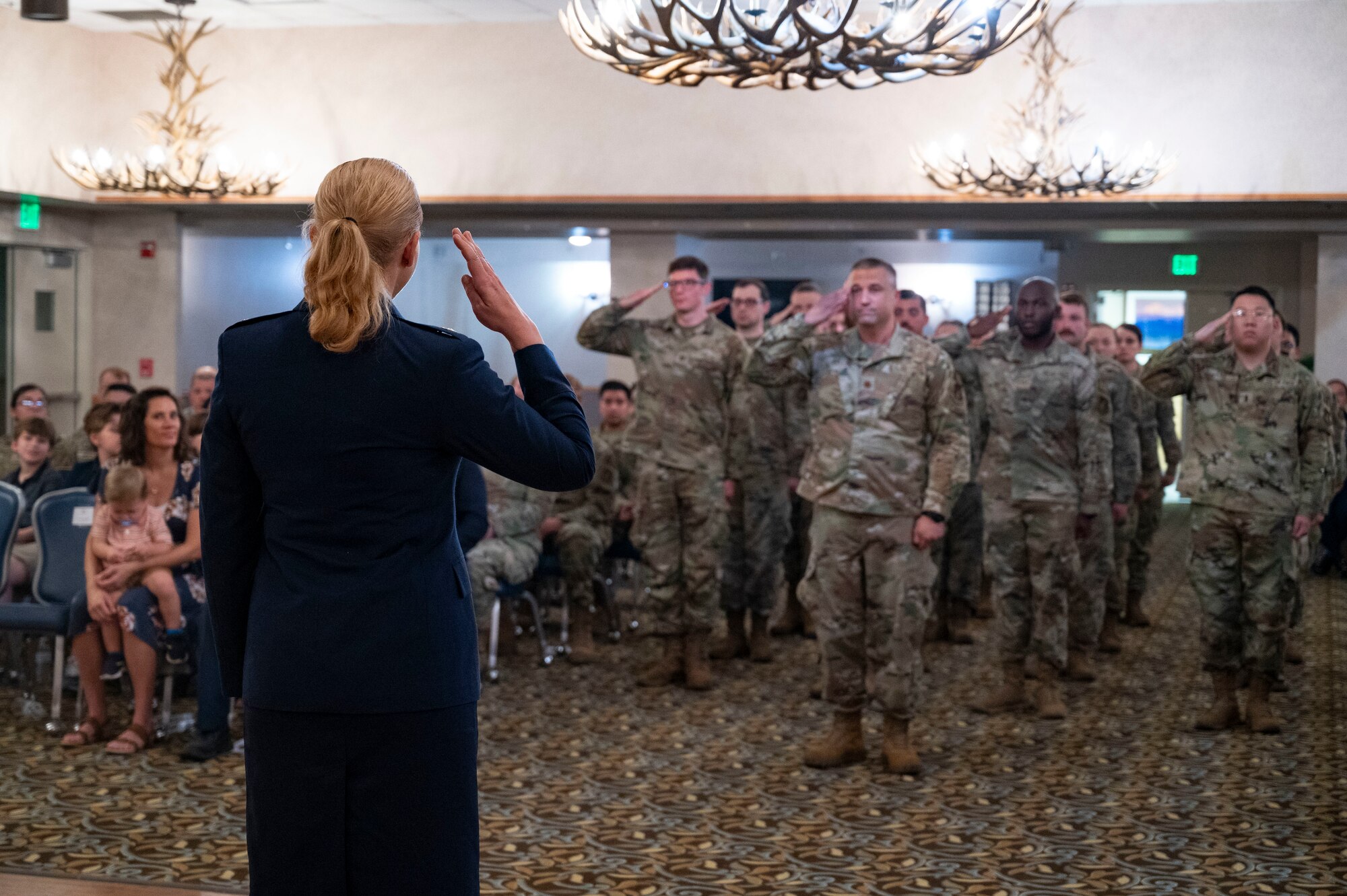 Lt. Col. Chelsea Payne, 354th Operational Medical Readiness Squadron outgoing commander, renders a final salute to Airmen from the 354th OMRS.