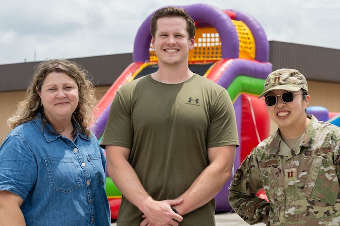 Three Airman pose for a photo