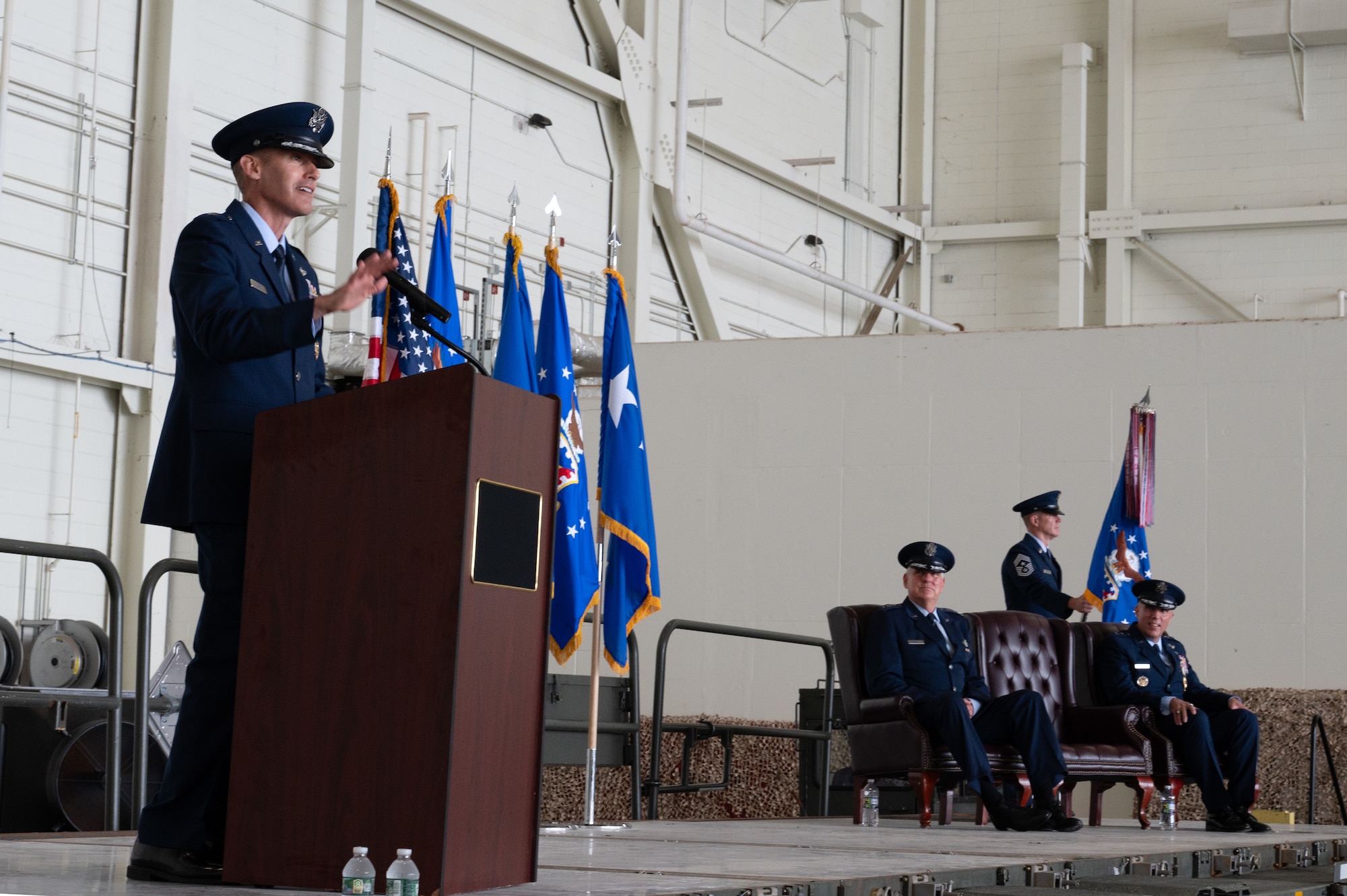 Brigadier Gen. Stephen Snelson accepts the guidon from Gen. Mike Minihan, Air Mobility Command commander, during the Expeditionary Center’s change-of-command ceremony at Joint Base McGuire-Dix-Lakehurst, New Jersey, July 12, 2024.