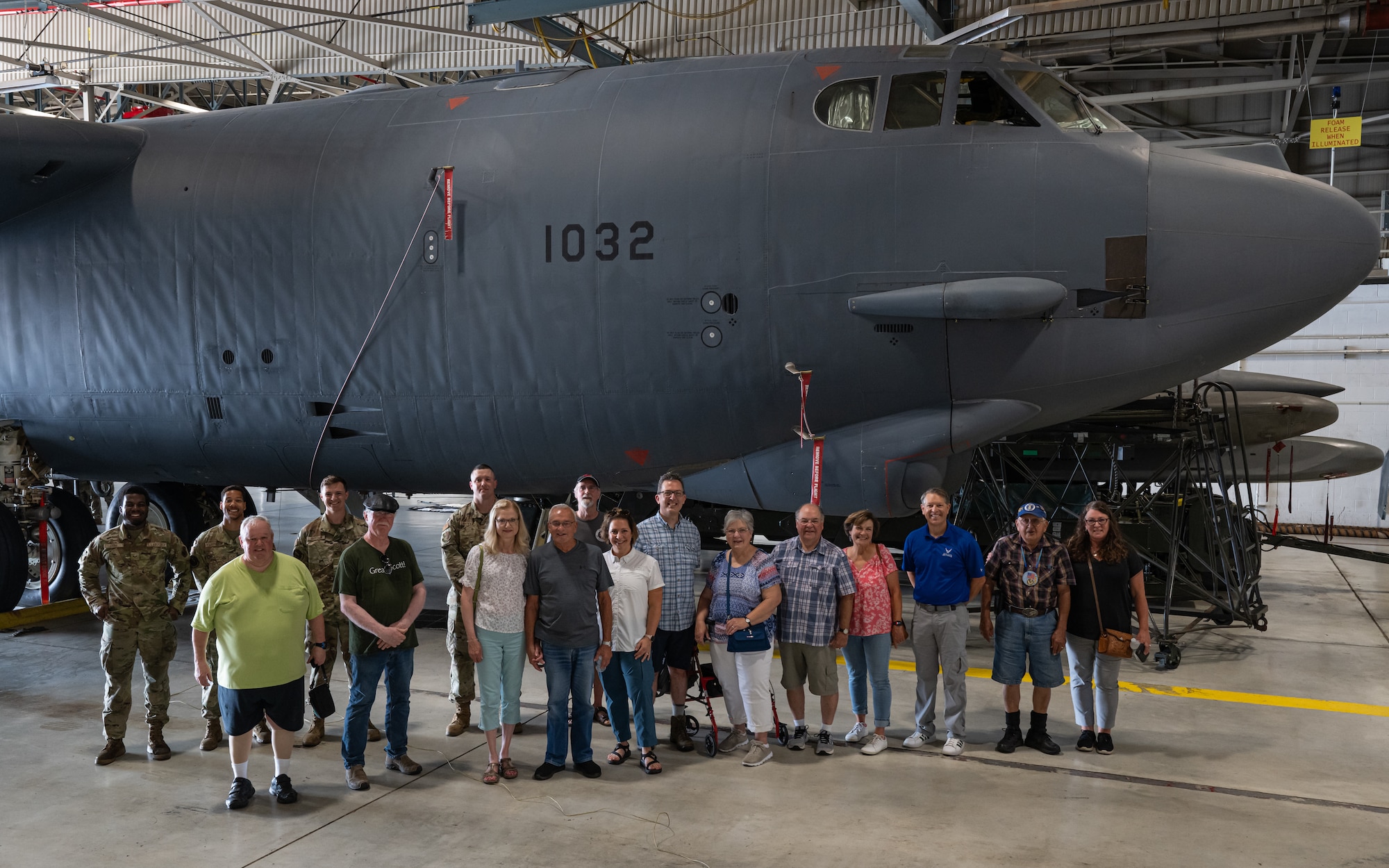 Airmen assigned to the 5th Maintenance Group and military retirees pose for a group photo in front of a B-52H Stratofortress during Retiree Appreciation Day at Minot Air Force Base, North Dakota, July 12, 2024. As part of Retiree Appreciation Day, military retirees got the opportunity to tour a B-52H Stratofortress hangar and learn how the B-52 has been modernized over the years. (U.S. Air Force photo by Senior Airman Kyle Wilson)