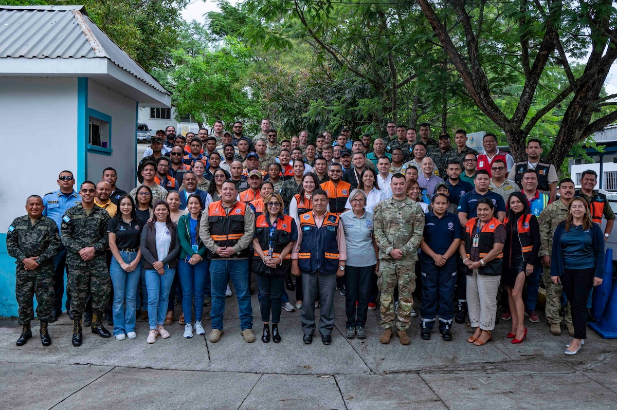 A photo of a large group of people posing for a photo.