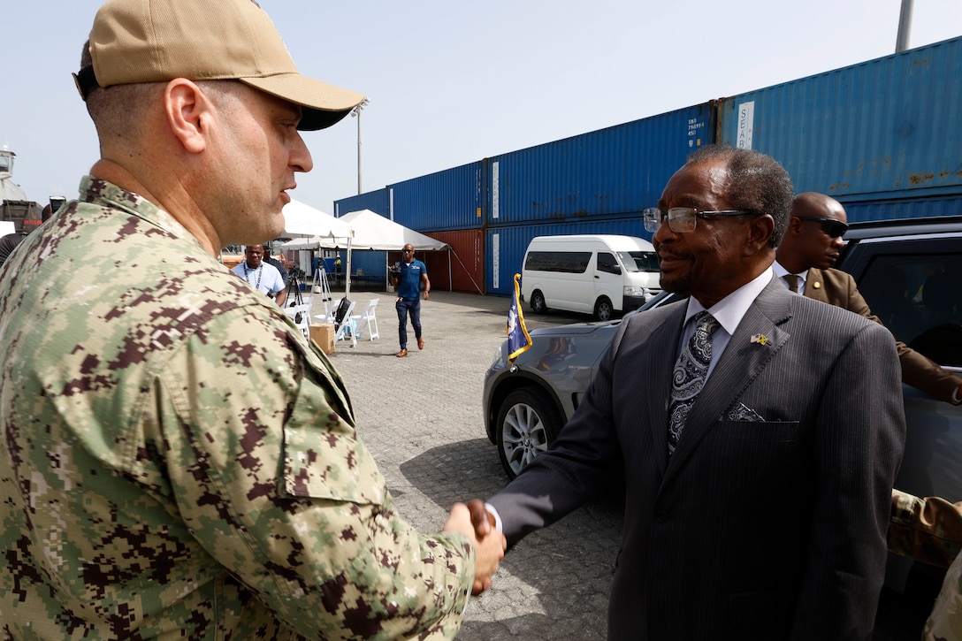 Lt. Cmdr. Zachary Smith, mission commander for Continuing Promise 2024, greets U.S. Ambassador to Jamaica N. Nick Perry as he visits the Spearhead-class expeditionary fast transport USNS Burlington (T-EPF 10) at the port of Kingston, Jamaica.  Continuing Promise 2024 marks the 14th mission to the region since 2007, which aims to foster goodwill, strengthen existing partnerships, and encourage the establishment of new partnerships among countries, non-government organizations, and international organizations.
