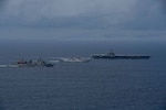 From front to back: The Arleigh Burke-class guided-missile destroyer USS Daniel Inouye (DDG 118), the Indian Navy Aditya-class replenishment and repair ship INS Aditya (A59), the Indian Navy Visakhapatnam-class stealth guided-missile destroyer INS Visakhapatnam (D66), and the Nimitz-class aircraft carrier USS Theodore Roosevelt (CVN 71) sail together in the Indian Ocean during a joint maritime activity, July 12, 2024.