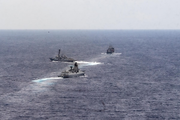 The Indian Navy Visakhapatnam-class stealth guided-missile destroyer INS Visakhapatnam (D66), front, the Arleigh Burke-class guided-missile destroyer USS Daniel Inouye (DDG 118), middle, and the Indian Navy Aditya-class replenishment and repair ship INS Aditya (A59) sail together in the Indian Ocean during a joint maritime activity, July 12, 2024.