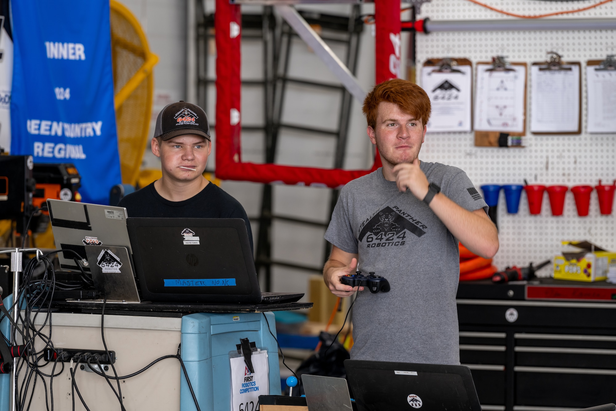 Local high school students control a robot at the 2024 Wings Over Whiteman STEM Fest at Whiteman Air Force Base, Mo., July 12, 2024. STEM Fest celebrated a nationwide challenge to foster creativity; critical thinking; and a passion for science, technology, engineering and mathematics among elementary, middle and high school students. (U.S. Air Force photo by Airman 1st Class Bryce Moore)