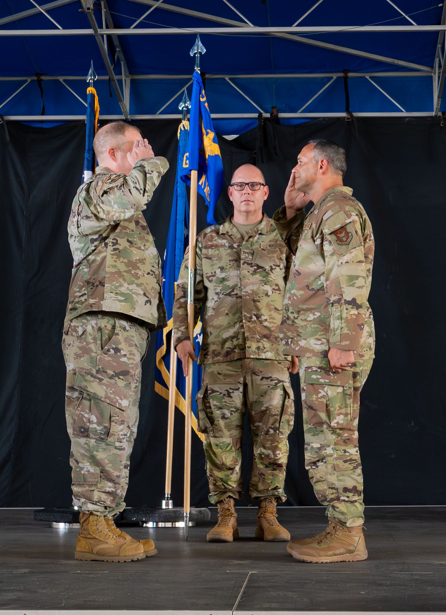 Col. Jessie Hamilton, 920th Rescue Wing commander, renders a salute to Col. Anthony Colberg.