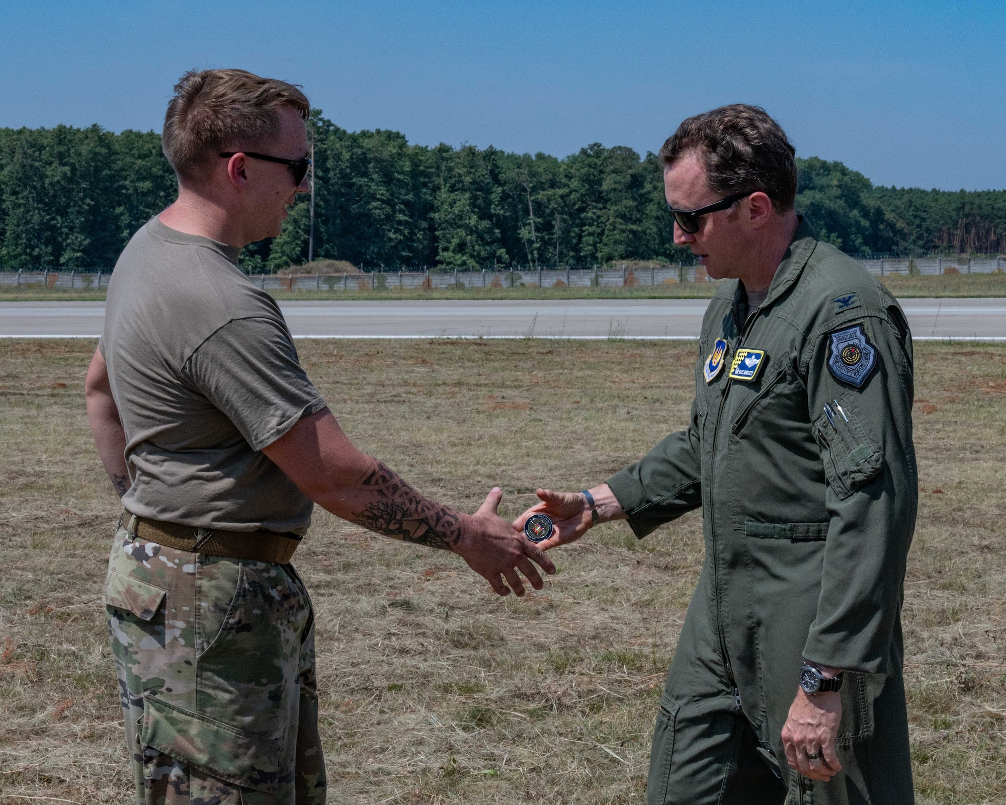 commander presents a challenge coin to