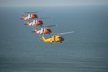 Coast Guard MH-60 Jayhawk helicopters fly flight formations at the Wright Brothers National Memorial, Wednesday, March 10, 2016.