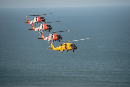 Coast Guard MH-60 Jayhawk helicopters fly flight formations at the Wright Brothers National Memorial, Wednesday, March 10, 2016.