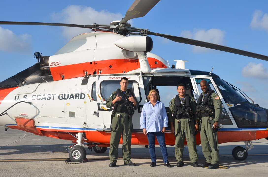 Commander of U.S. Coast Guard Air Station Miami Capt. Michael Platt, meets with Ileana Ros-Lehtinen, U.S. representative of Florida's 27th district. The congresswoman boarded an MH-65D Helicopter in order to assess damages