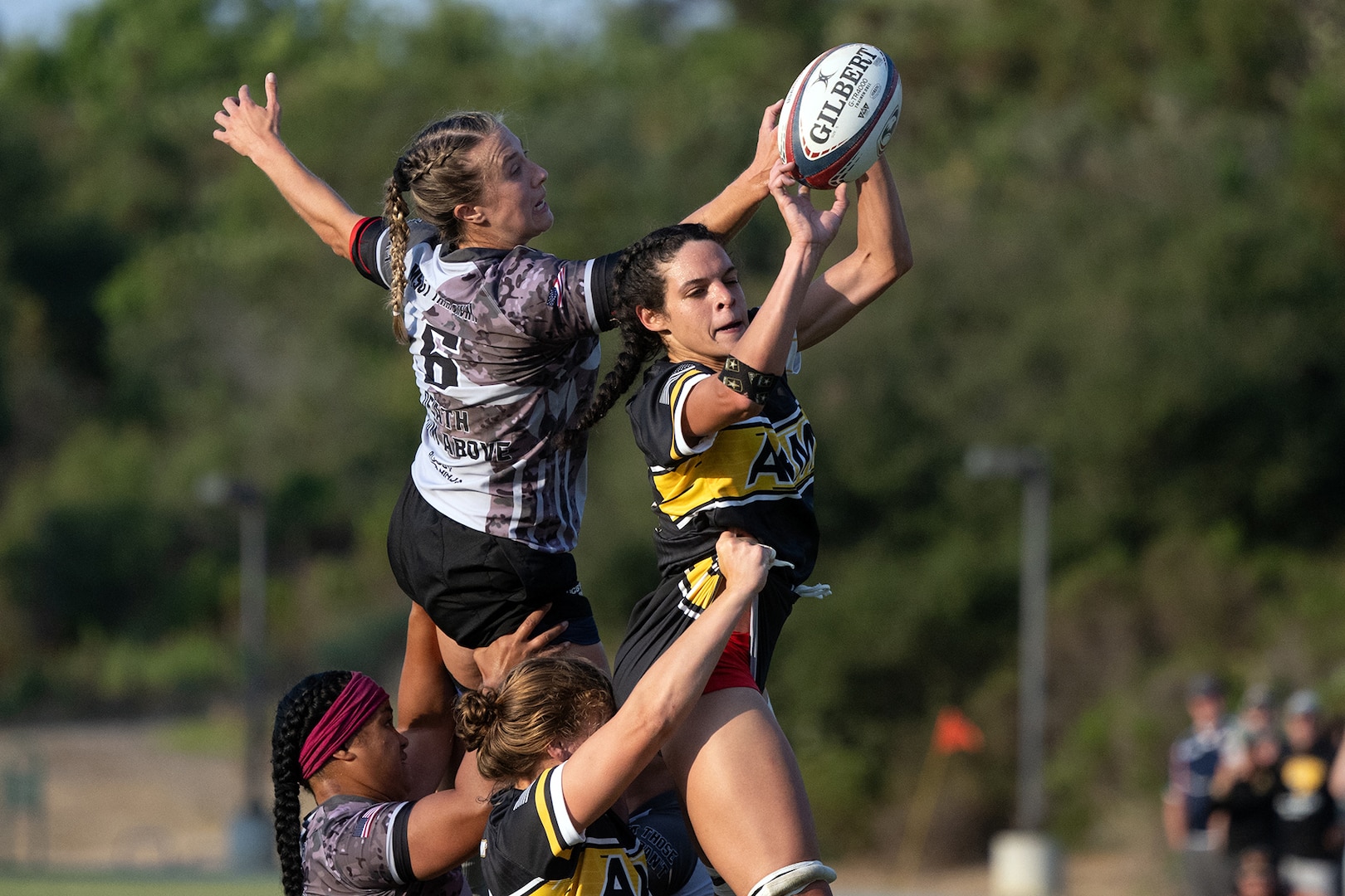Army 1st Lt. Cienna Jordan, right, and Air Force Capt. Katie Mueller battle for a ball during the 2024-Armed Forces Women’s Rugby Championships held in conjunction with the San Diego Surfers Women’s Rugby Club 7’s Tournament in San Diego, Calif. from July 12. (DoD photo by EJ Hersom)