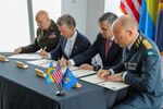 Leaders from the New York National Guard and the Swedish military sign an agreement for joint training as part of the National Guard State Partnership Program at New York’s Freedom Tower July 12, 2024. Maj. Gen. Ray Shields, left, the adjutant general of New York; Pal Jonson, Sweden's Minister for Defence; Marcos Soler, deputy secretary for public safety for the state of New York; and Maj. Gen. Johan Pekkari, Sweden’s Chief of Policy and Plans, sign the document. (U.S. Army National Guard photo by Stephanie Butler)