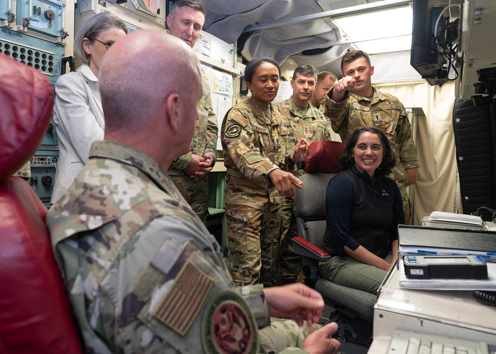 1st Lt. Connor Tovey, 319th Missile Squadron missileer, explains aspects of a launch control capsule to a visiting group in the A-01 missile alert facility near Pine Bluffs, Wyoming, July 2, 2024. Under Secretary of the Air Force Melissa Dalton and Chief Master Sgt. of the Air Force David Flosi visited the 90th Missile Wing at F.E. Warren Air Force Base, Wyoming, and the missile field to see first-hand how ICBMs provide a responsive, reliable, and stable deterrent critical to the U.S. National Security Strategy. (U.S. Air Force photo by Glenn S. Robertson)